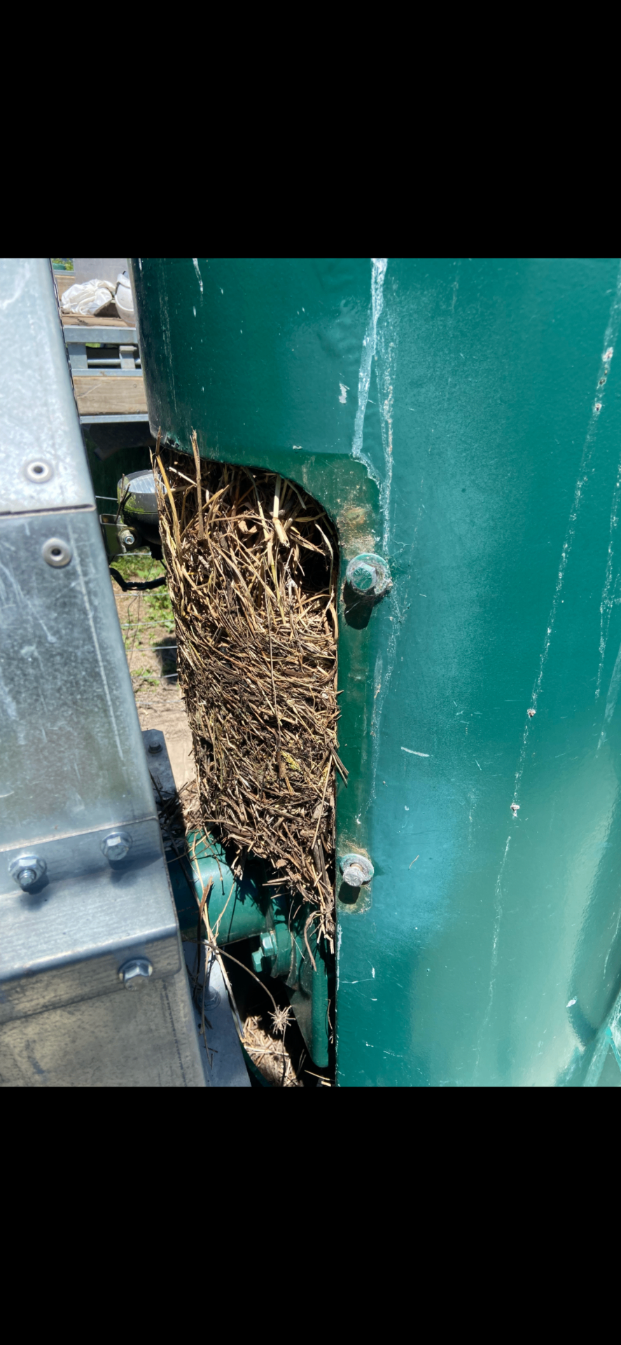 Bird's nest debris blocking a frost fan engine air intake