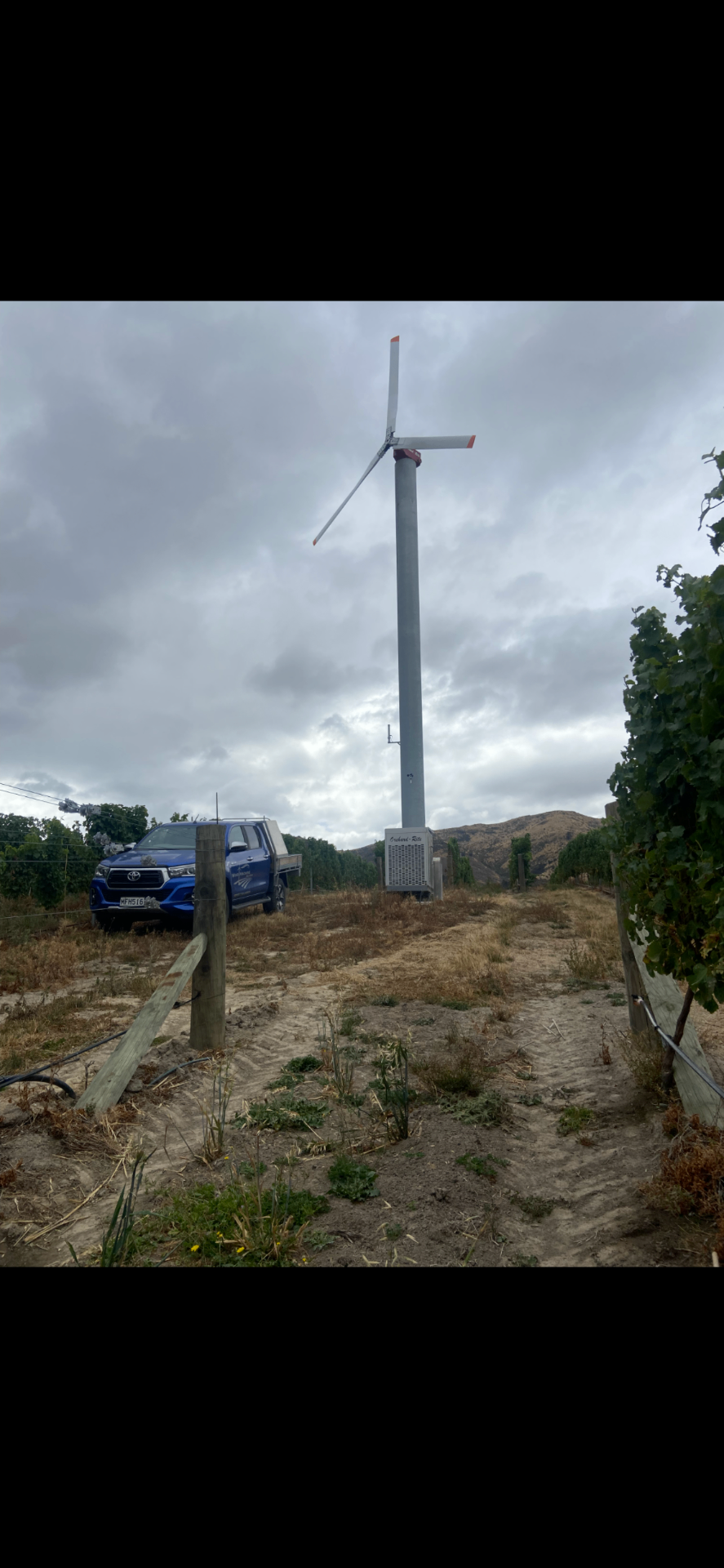 Wind Machine Solutions crew servicing an Orchard-Rite frost fan in a Marlborough vineyard